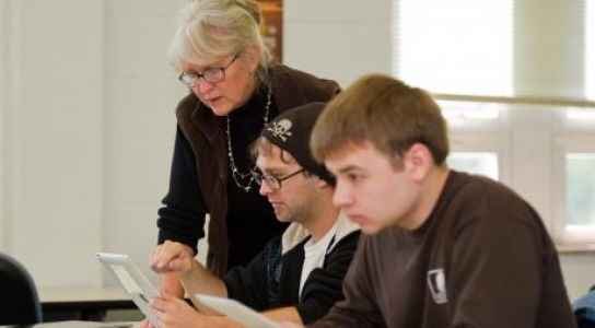 Instructor helping students