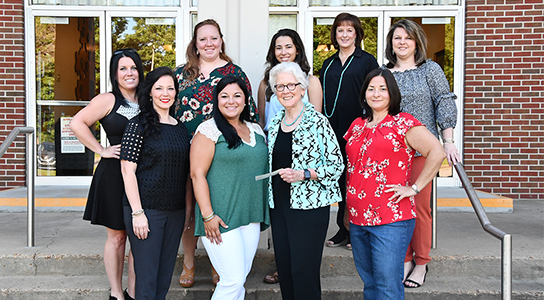 ABWA poses for a photo during a check presentation to DSCC