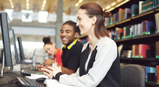 Information Systems students working at computers