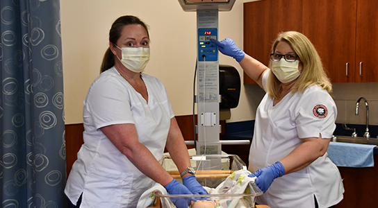 Students in Nursing lab practicing patient care.